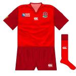 England (alt): Drawn in the same group as Fiji, England lost the toss for colours and home dressing room in the opening game. The change strip was in the same style as the white but in two-tone red.